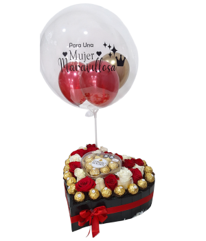 Caja en forma de corazón con rosas, chocolates Ferrero Rocher y un globo con mensaje "Para una mujer maravillosa.