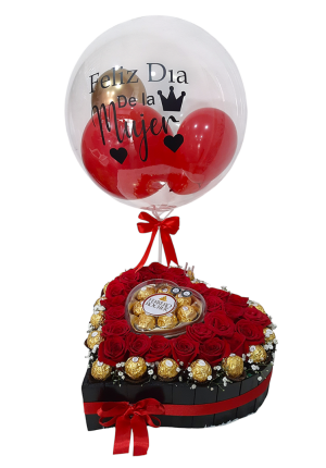Caja en forma de corazón con rosas rojas y chocolates Ferrero Rocher, decorada con globo de "Feliz Día de la Mujer.