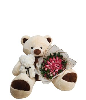 Oso de peluche con flores y un osito pequeño de flores.