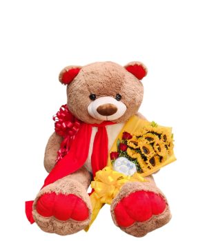 Oso de peluche con flores rojas y girasoles.