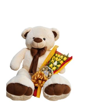 Oso de peluche con flores amarillas y chocolates.