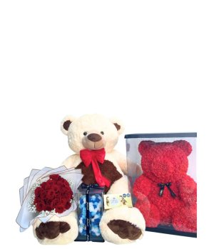 Oso de peluche con flores rojas y chocolates.