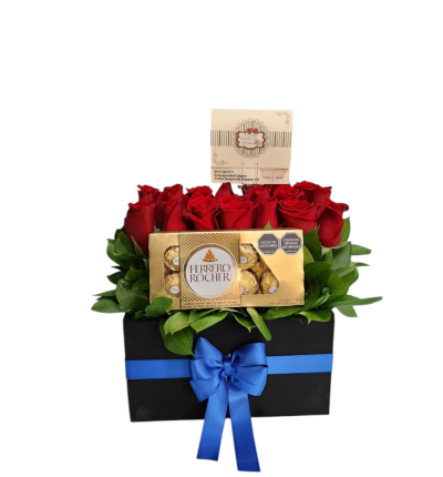 Caja cubo con rosas rojas y chocolates Ferrero, un detalle elegante y delicioso para cualquier ocasión especial.