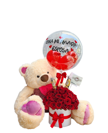Cilindro decorativo con rosas rojas, peluches, chocolates y un globo personalizado, ideal para regalos especiales.